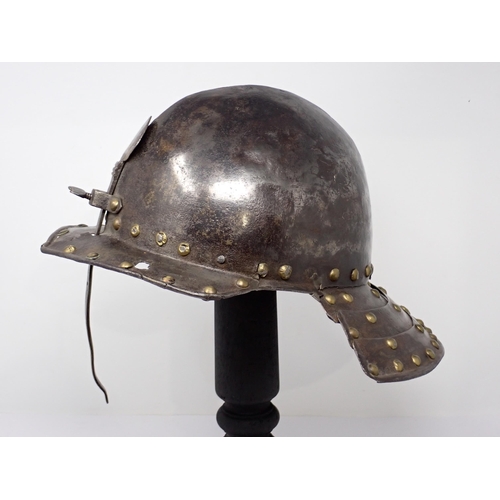 1362 - A 17th century continental cavalry helmet. Two piece pot with three lame articulated neck guard and ... 