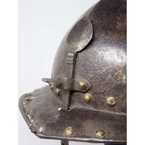 1362 - A 17th century continental cavalry helmet. Two piece pot with three lame articulated neck guard and ... 