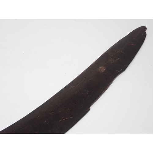 1390 - An early 19th century Aboriginal boomerang. Very finely stone carved. 28” overall