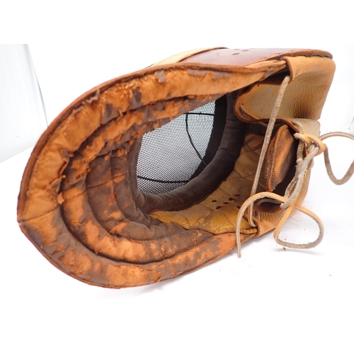 1411 - An early 20th Century Wilkinson Sword Fencing Mask with wire gauze face cover and leather ear guards... 