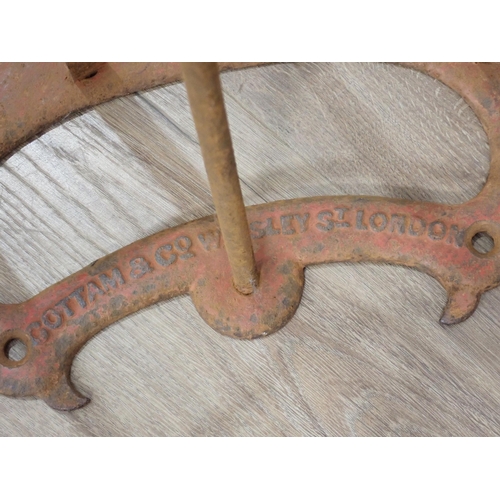 1468 - Two antique metal Saddle Racks by Cottam & Co., Winsley Street, London