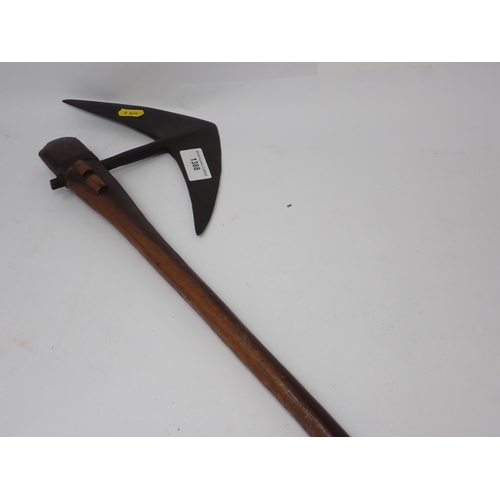 1388 - A South African Bantu axe. Sharply angled steel axe head with tang set into a dark wood shaft. Raise... 