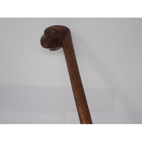 1389 - A South African carved wooden staff with stylised ‘bird head’ type top including two snuff wells. 47... 