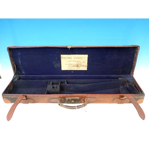 1406 - An antique leather fitted Gun Case for a side by side 28in 12 bore barrelled gun, with Henry Atkin l... 