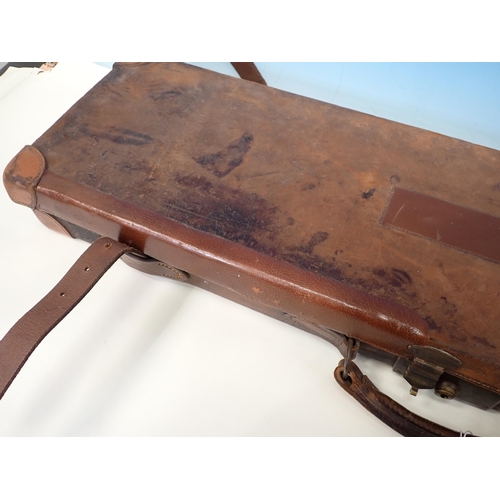 1406 - An antique leather fitted Gun Case for a side by side 28in 12 bore barrelled gun, with Henry Atkin l... 