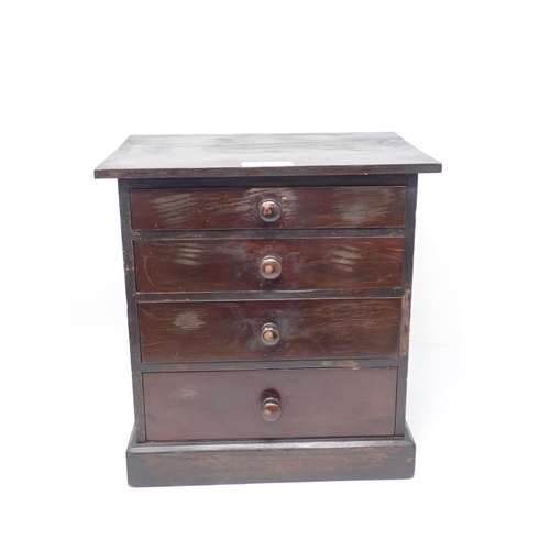 1536 - A stained pine Collector's Cabinet fitted four graduated drawers on plinth base containing a collect... 