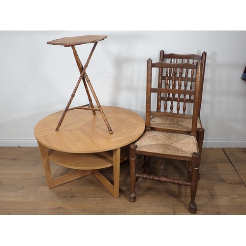 10 - A mahogany occasional two tier Table, two rush seated Chairs and a modern circular Coffee Table