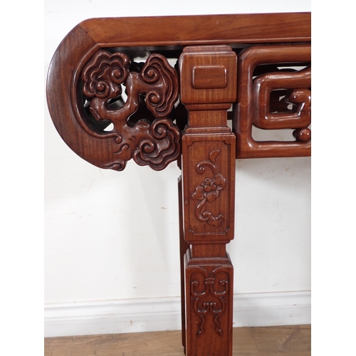 1 - A Chinese hardwood Serving Table with carved and pierced frieze, the squared supports with surface c... 