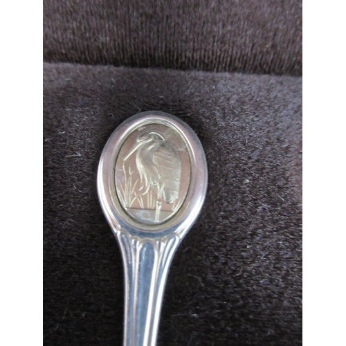 114 - A set of one dozen silver RSPB Spoons with various bird finials, London 1978, in case