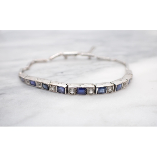 179 - An Art Deco white metal Bracelet the front with articulated rectangular links each set blue and whit... 