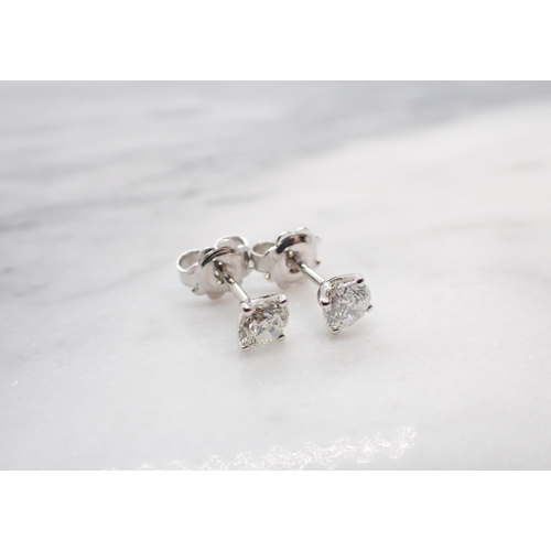 180 - A pair of Diamond Ear Studs each claw-set brilliant-cut stone, total diamond weight 1.01cts, in 18ct... 