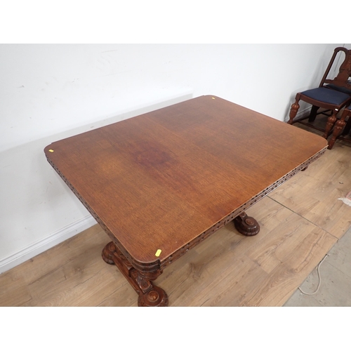 24 - An carved oak Dining Suite including Sideboard, drawleaf Table and four Chairs