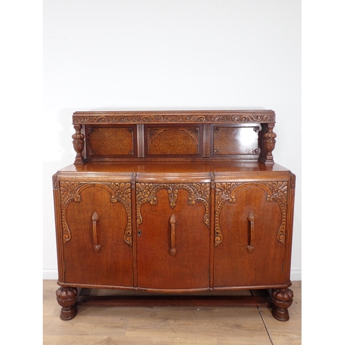 24 - An carved oak Dining Suite including Sideboard, drawleaf Table and four Chairs