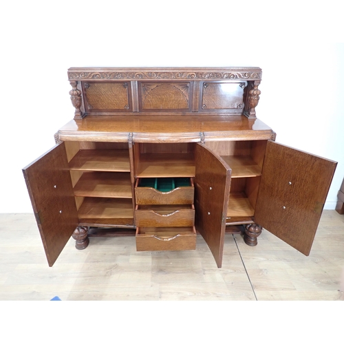 24 - An carved oak Dining Suite including Sideboard, drawleaf Table and four Chairs