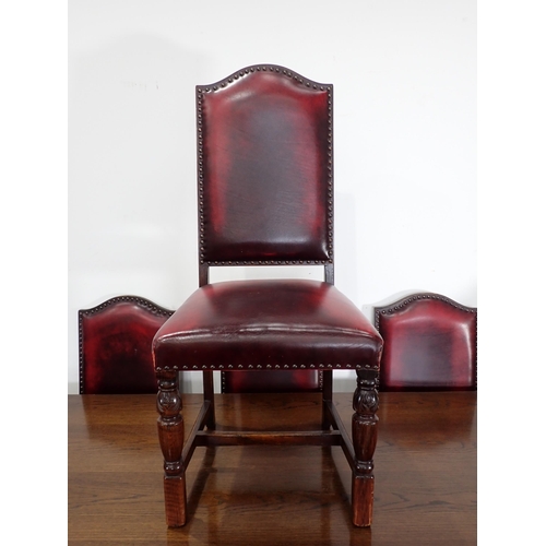 240 - An oak draw leaf Refectory Table 6ft W x 2ft 6in H and eight red leather covered oak Dining Chairs