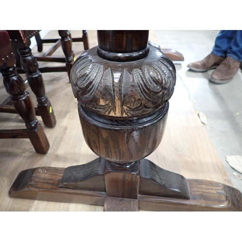 240 - An oak draw leaf Refectory Table 6ft W x 2ft 6in H and eight red leather covered oak Dining Chairs