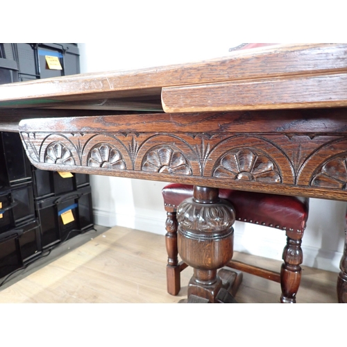 240 - An oak draw leaf Refectory Table 6ft W x 2ft 6in H and eight red leather covered oak Dining Chairs