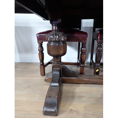 240 - An oak draw leaf Refectory Table 6ft W x 2ft 6in H and eight red leather covered oak Dining Chairs