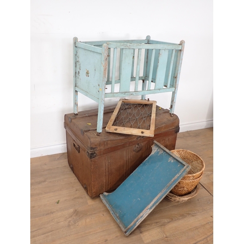 243 - A tine Trunk containing child's garden seats, table and baskets