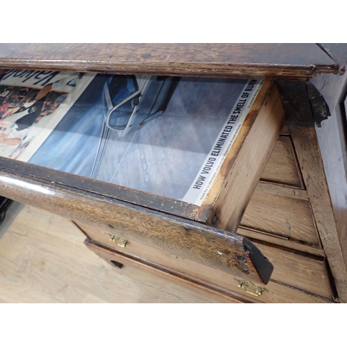 244 - An 18th Century oak Chest fitted secret drawer above two short and three long drawers on concave bra... 