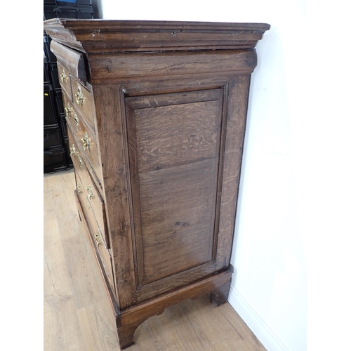 244 - An 18th Century oak Chest fitted secret drawer above two short and three long drawers on concave bra... 