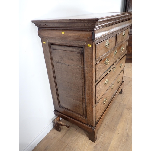 244 - An 18th Century oak Chest fitted secret drawer above two short and three long drawers on concave bra... 