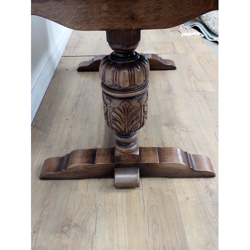 254 - An oak draw leaf Dining Table 4ft 6in W x 2ft 6in H and six brown leather effect covered Dining Chai... 