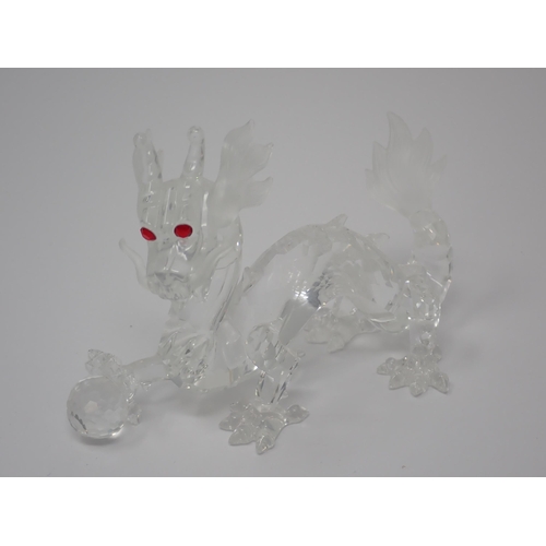 264 - A Swarovski crystal figure of a Unicorn A/F, boxed and another of a dragon, 5in A/F, boxed