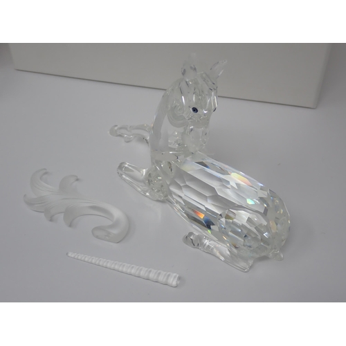 264 - A Swarovski crystal figure of a Unicorn A/F, boxed and another of a dragon, 5in A/F, boxed