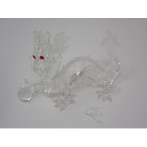 264 - A Swarovski crystal figure of a Unicorn A/F, boxed and another of a dragon, 5in A/F, boxed