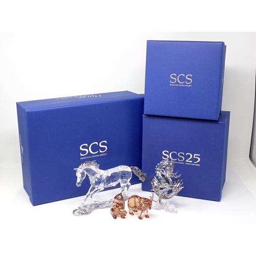 265 - A Swarovski crystal model of a horse, 8in, boxed, a pair of Swarovski Bears, boxed and another of a ... 