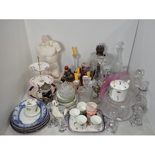 274 - An oil Lamp, a Cake Stand, a model of a torso, Decanters, Plates etc.