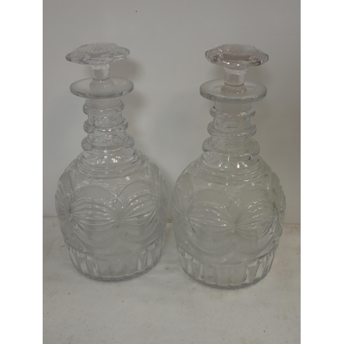 281 - A pair of antique triple ring Decanters and stoppers, 10in H, and three other Decanters and Stoppers