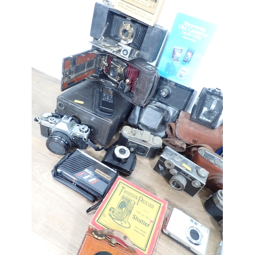 309 - Two boxes of various box Cameras, 35mm Cameras, a Magic Lantern etc.