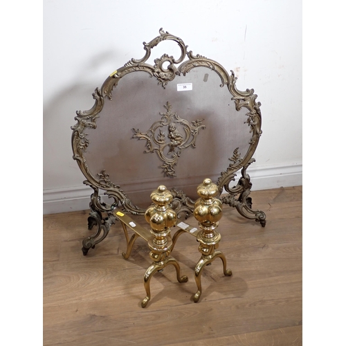 35 - A brass Fire Screen decorated scrolls and a cherub, 2ft 4in H and a pair of brass Fire Dogs