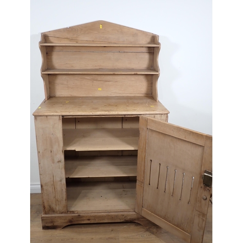 36 - A pine Food Cupboard, with raised back and fitted pierced single door, 5ft 2in H x 3ft W