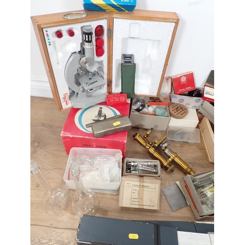 369 - A box containing brass Microscope, various Bulbs and Bottles