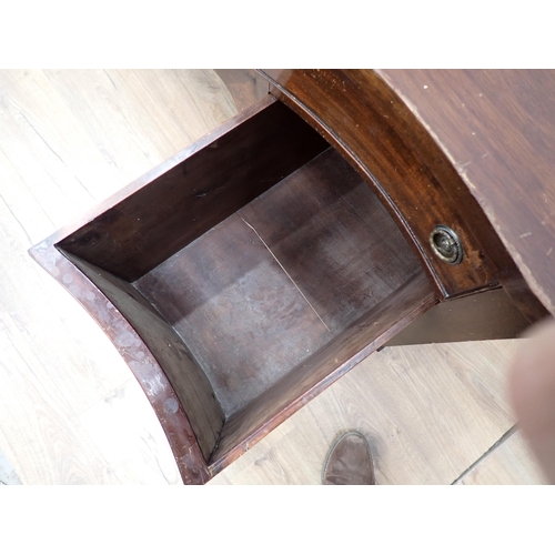 390 - A mahogany veneered serpentine fronted Sideboard fitted four drawers