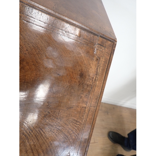 393 - A Georgian style walnut  and feather banded Bureau with fall front enclosing fitted interior above t... 