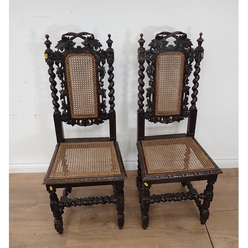 394 - A pair of Victorian oak Hall Chairs with cane infilled back and seats