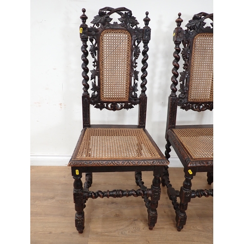 394 - A pair of Victorian oak Hall Chairs with cane infilled back and seats