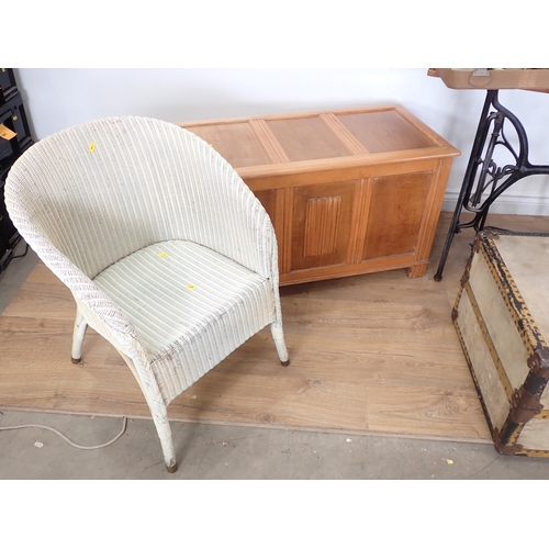 4 - A Lloyd Loom Armchair, a Blanket Box, a large Trunk, a Cresta Sewing Machine, a Table made from a tr... 