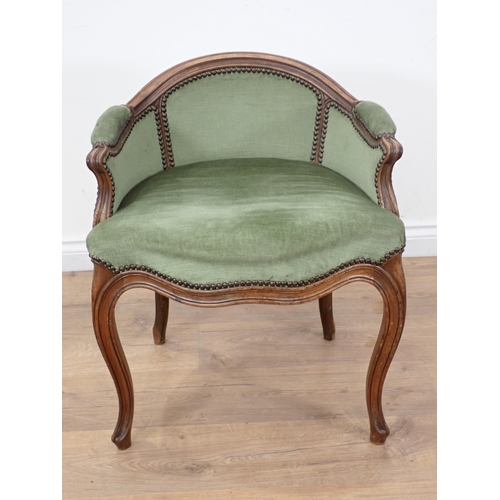 450 - A French walnut framed low backed Elbow Chair