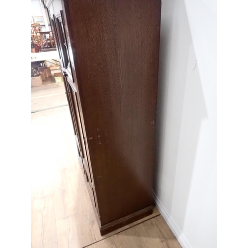 469 - An oak two door Wardrobe with arcaded panel doors 5ft 6in H x 3ft 4in W