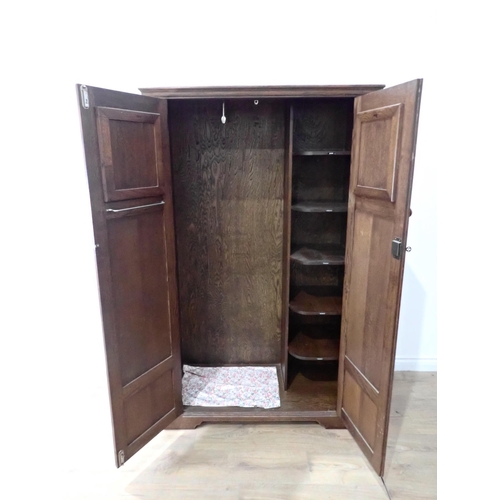 469 - An oak two door Wardrobe with arcaded panel doors 5ft 6in H x 3ft 4in W