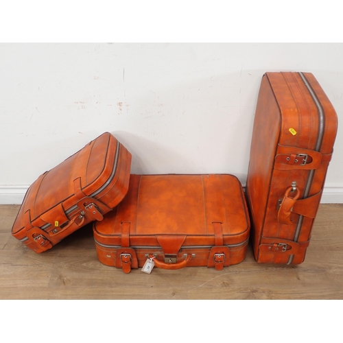 479 - Three leather Luggage Cases containing curtains