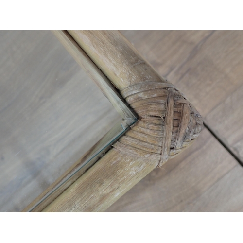 481 - A 19th Century mahogany Elbow Chair with rope twist back and a glass topped bamboo Coffee Table