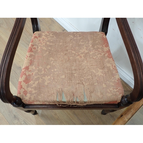 481 - A 19th Century mahogany Elbow Chair with rope twist back and a glass topped bamboo Coffee Table