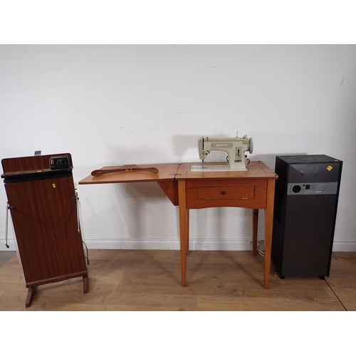 493 - A Sewing Machine, Trouser Press and an Amcor Dehumidifier, (passed PAT)