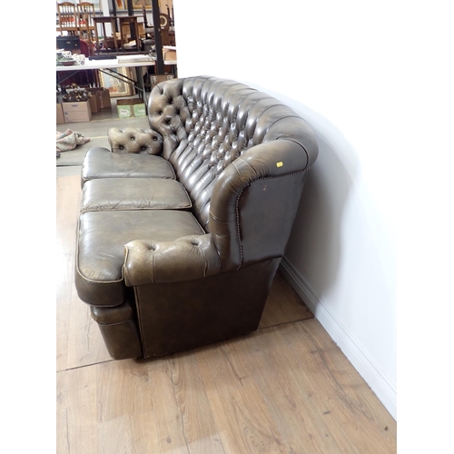 497 - A modern green leather button back Settee 6ft 4 in W, 3ft H, 3ft D, seat height 1ft 6in